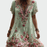 Vintažo stiliaus suknelė su trumpomis rankovėmis ir elegantiškų gėlių siuvinėjimu