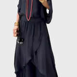 Plačios viršutinės dalies ir suplėšytos kelnės – dviejų dalių sijonas iš šifono