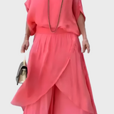 Plačios viršutinės dalies ir suplėšytos kelnės – dviejų dalių sijonas iš šifono